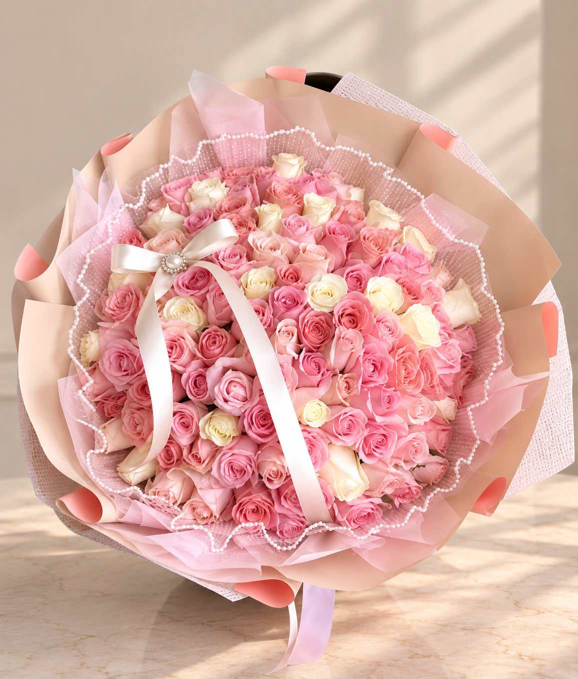 Grand blush pink and ivory rose bouquet with pearl-trimmed tulle and satin ribbon