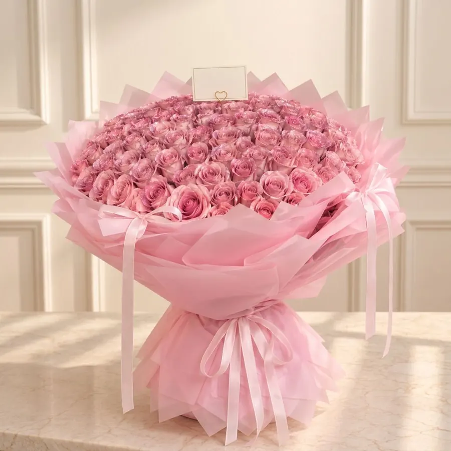 Grand bouquet of shimmering blush roses in layered pink wrapping